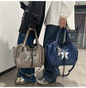Close-up of waterproof nylon tote bags with star patterns and checkered bear charms