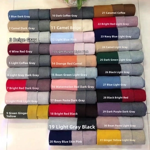 Macro display of thirty-one assorted cashmere-like scarf colors in soft textured rolls