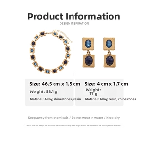 Macro view of vintage gold necklace and earring set with blue resin and size parameters