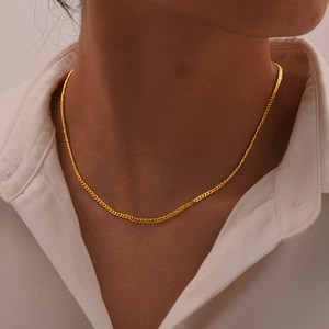 Classic 14K gold plated stainless steel curb chain necklace shown on model neckline