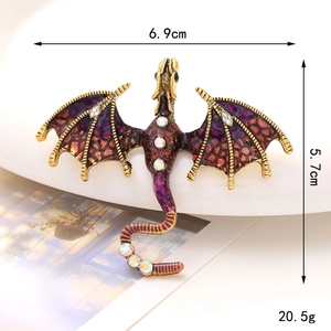Detail view of purple enamel dragon brooch with rhinestones showing dimensions 6.9x5.7cm