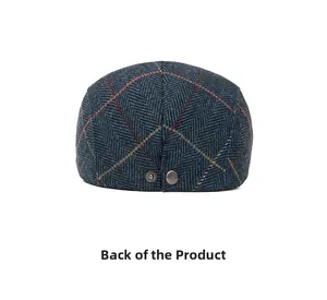 Rear view of wool blend flat cap featuring blue herringbone pattern and metal snap buttons