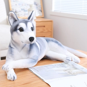 Detailed close-up of realistic husky plush toy with soft grey and white fur on a wooden table