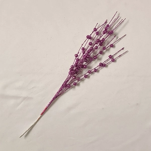 Close-up of artificial purple glitter berry stems with a sparkling beaded texture finish