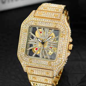 Detailed close-up of a luxury square gold watch with iced-out diamonds and hollow dial