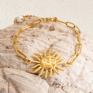 Golden stainless steel sun face charm bracelet with thick chain and pearl accent on stone
