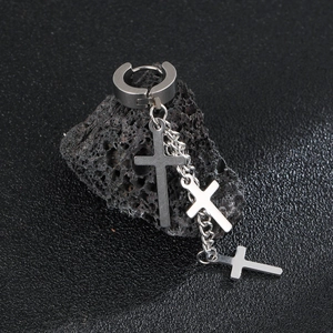 Punk style stainless steel cross chain tassel earrings on black volcanic rock display