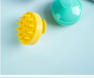 Detail of yellow and cyan silicone scalp massagers showing tapered bristles and handles