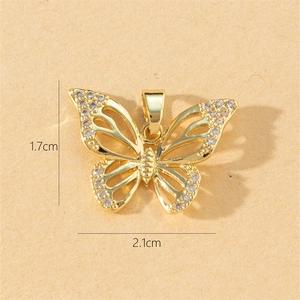 Macro shot of gold butterfly pendant with cubic zirconia and 1.7x2.1cm dimensions