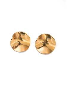 Detailed view of irregular wavy gold-plated stainless steel studs with polished finish