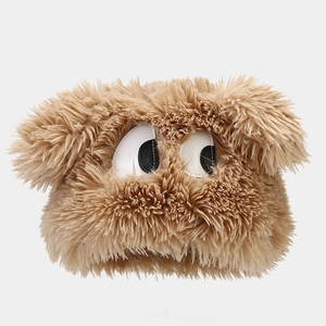 Detailed view of fluffy brown plush material with creative monster eyes design