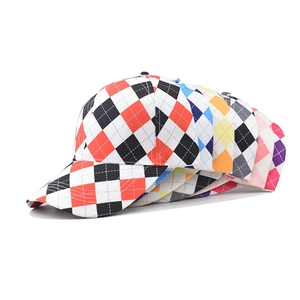 Stacked view of multi-colored diamond pattern baseball caps with curved brims