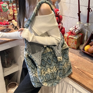 Detailed close-up of large plush tote bag with diamond texture and checkered lining