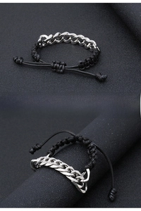 Detail of adjustable black woven rope spliced with silver stainless steel Cuban chain link