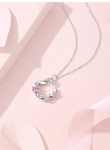 Detail view of S925 silver moon wreath necklace featuring pink and white zircons