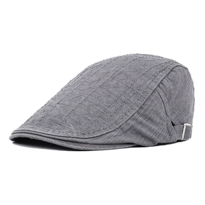 Detail of grey cotton flat cap featuring wavy stitching and adjustable metal side buckle