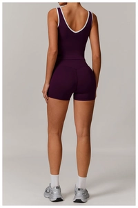 Back view of high-waist purple yoga set with cross-back sports bra and slim fit shorts