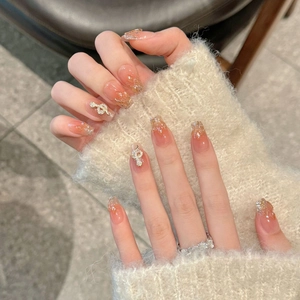 Elegant gradient pink press-on nails with silver glitter and rhinestone music note charms