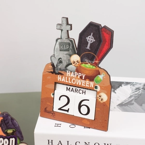 Close-up of wooden Halloween countdown calendar featuring a tombstone and coffin design