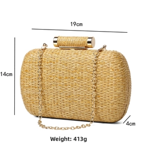 Detail view of woven evening clutch dimensions 19x14x4cm with golden metal clasp