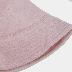 Close-up of pink terry cloth sun hat showing embroidery and multi-row reinforced stitching