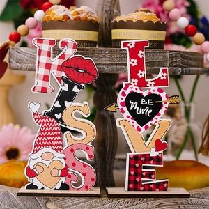 Detail view of KISS and LOVE wooden Valentine gnome signs on a rustic tray decor