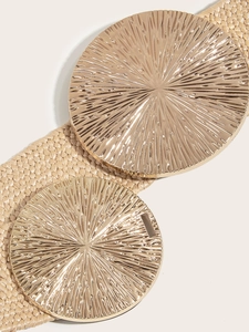 Close-up of beige woven belt featuring elegant golden sunburst metal buckles detail