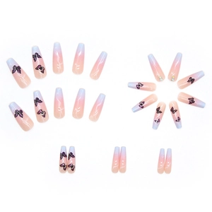 Long coffin gradient press-on nails with blue butterfly prints and rhinestones