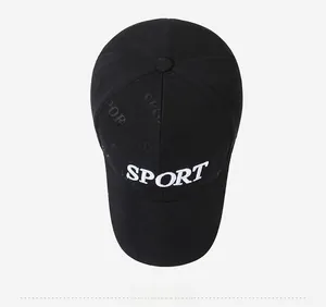 Top view of black baseball cap featuring white SPORT embroidery and embossed letter patterns