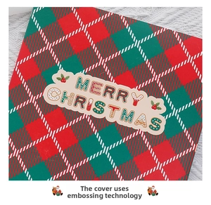 Detail of 3D Christmas wreath card cover with embossing and festive patterns