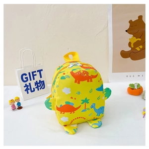 Detail of yellow toddler backpack with cartoon dinosaur patterns and 3D green wings