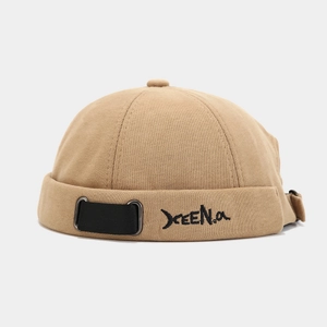 Detail of khaki miki hat with letter embroidery, adjustable webbing and metal rings