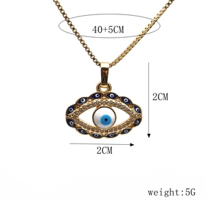 Detail view of gold Evil Eye necklace with dimensions 40+5cm chain and 2cm pendant