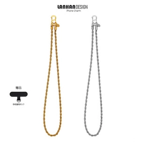 Detail of twisted metal phone charms in gold and silver with black tether tabs