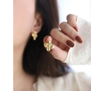 Elegant 18K gold plated liquid metal irregular flower stud earrings for women