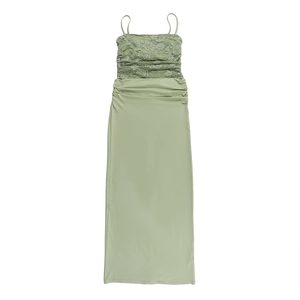 Detail of light green floral lace patchwork and gathered pleats on this slim camisole dress