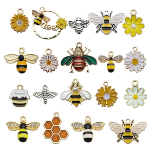 Enamel bee and sunflower alloy pendants set for DIY jewelry making on white background