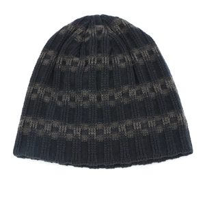 Close-up of winter knit beanie showing thick ribbed texture and brown striped pattern