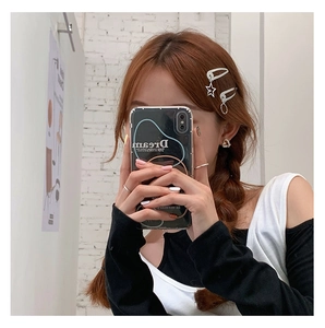 Close-up of trendy silver metal hair clips with star charms and heart earrings