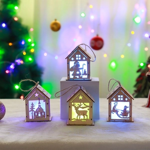 Lighted wooden Christmas house ornaments with LED warm glow and festive reindeer motifs