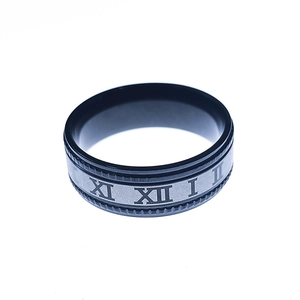 Detail showing the Roman numerals engraving on a black and silver stainless steel ring