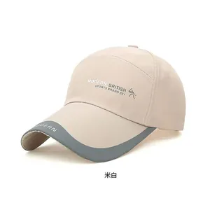 Detail of beige outdoor baseball cap with side logo print and gray contrast brim edge