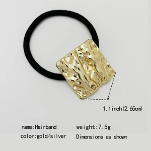 Elastic black hairband featuring a golden square textured metal charm on white background