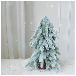 Close-up of a 45cm flocked mini Christmas tree with snow texture and cedar wood base