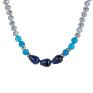 Bohemian necklace with blue natural stones, faceted beads and golden spacers on white backdrop
