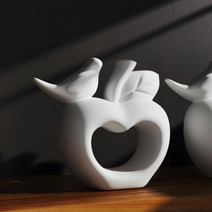 Artistic hollow apple sculpture with bird detail for modern minimalist home decor
