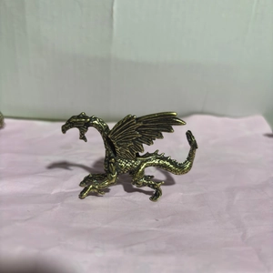 Detailed bronze flying dragon sculpture with scales and wings for desk decoration