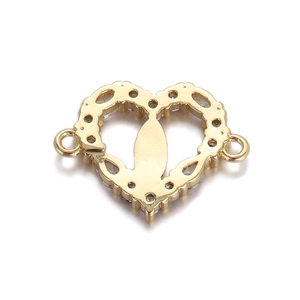 Macro shot of gold heart jewelry connector with tiny crystals and side connection loops