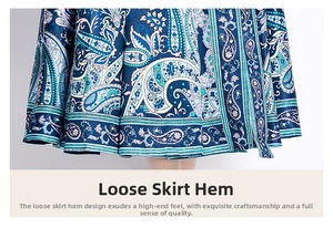 Detail of A-line dress hem featuring intricate blue paisley ethnic print patterns