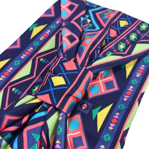 Close-up of bohemian extra wide sports headband with colorful geometric print patterns